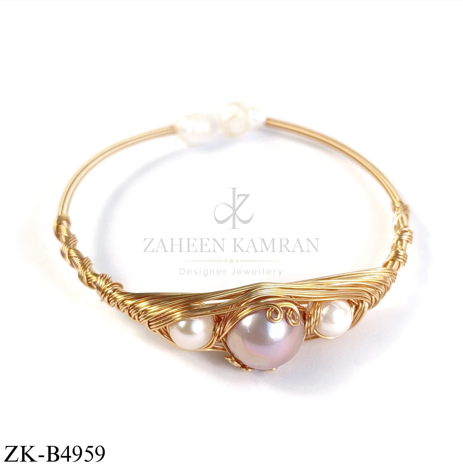GOLD WIRE CUFF WITH PEARLS SND AND CENTRE SOFT PINK STONE
