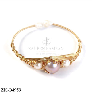 GOLD WIRE CUFF WITH PEARLS SND AND CENTRE SOFT PINK STONE