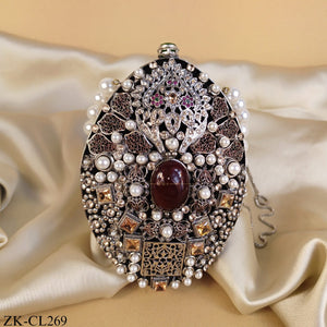 SILVER AMBER CLUTCH WITH DEEP RED CENTRE STONE