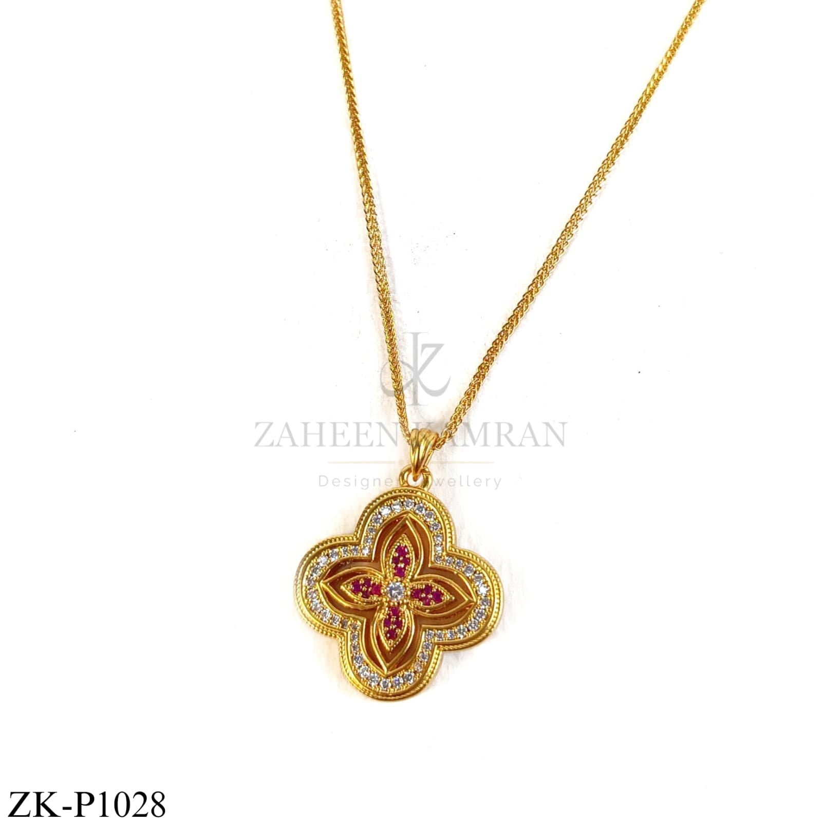 Golden floral pendant with red stone petals - Zaheen Kamran Zamaré Collection