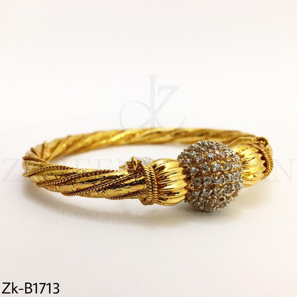 Twisted gold bangle