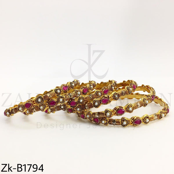 Ruby pearls bangles