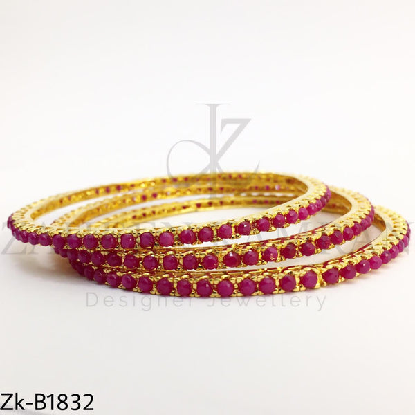 Ruby gold bangles