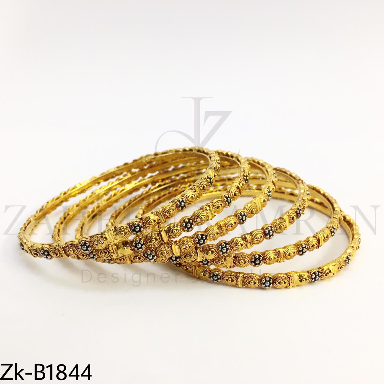 Sleek golden bangles