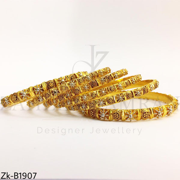 Detailed golden bangles