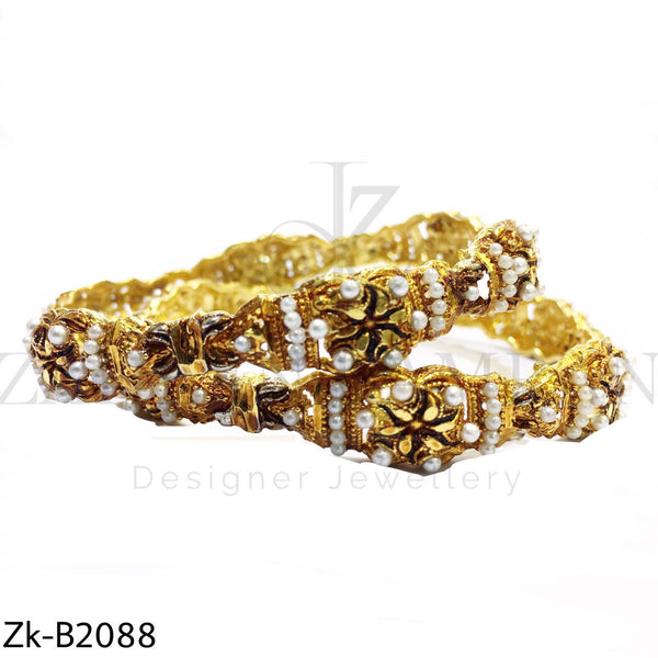 Golden pearls bangles