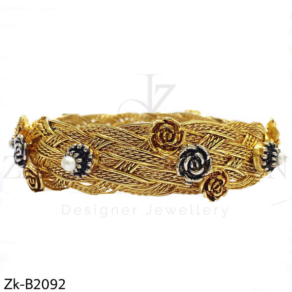 Braided floral bangle