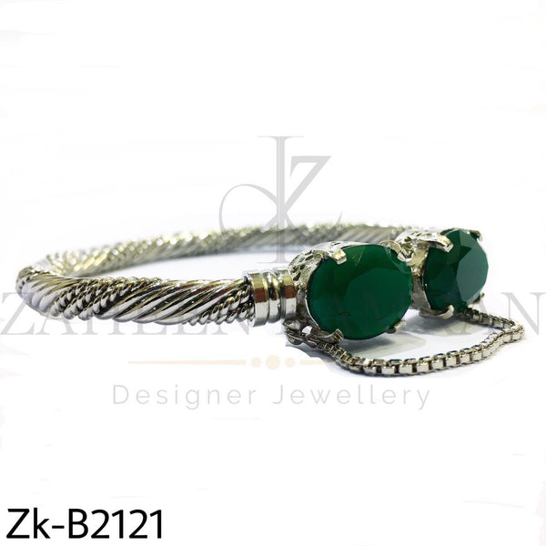 Twisted emerald bangle