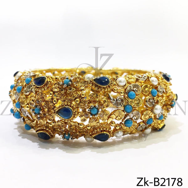 Broad detailed bangle