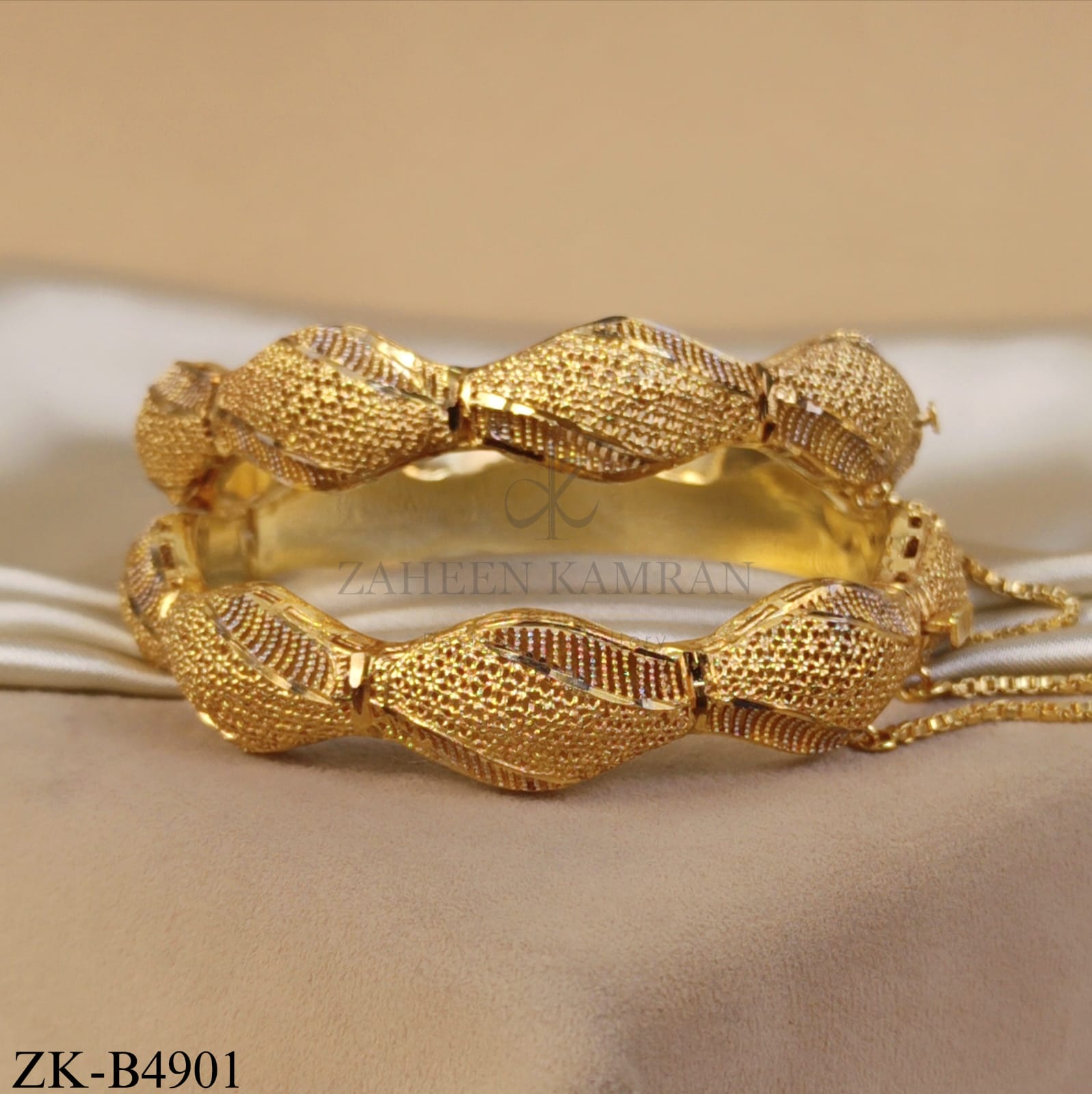 TEXTURED GOLD TWISTED BOW BANGLES