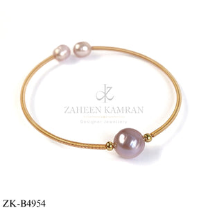 GOLD TONE WIRE BANGLE WITH SOFT PINK SPHERES