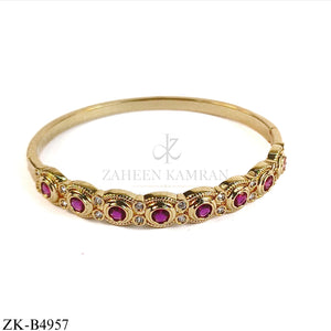 GOLD TONE PINK ZIRCONIA BANGLE