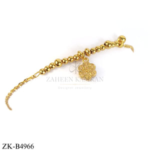 GOLDEN BEADS AND CENTRE FLORAL BRACELET