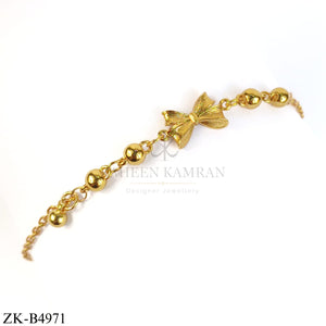 GOLD TONE ROUND BEADS AND CENTRE BOW BRACELET