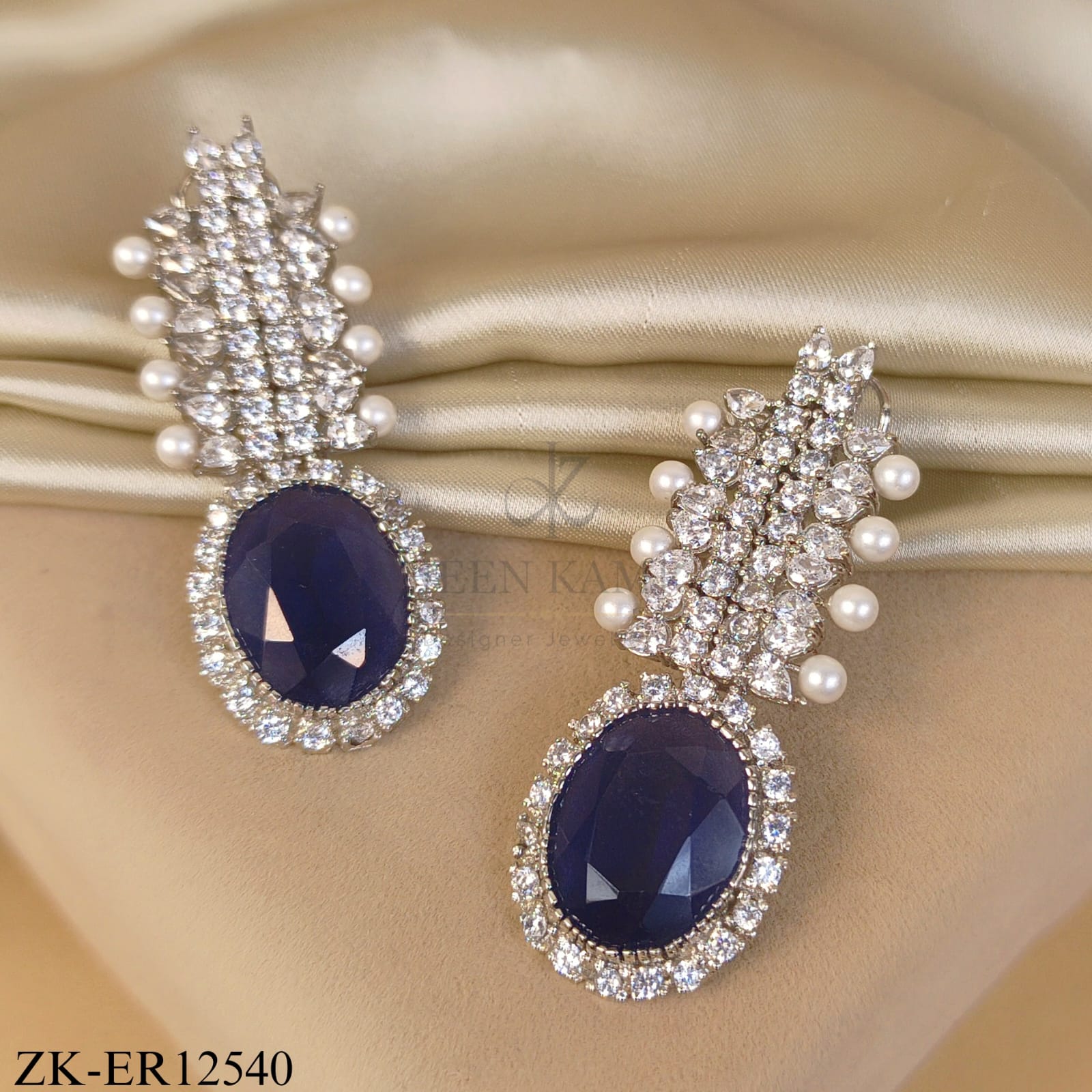PEARLS EDGE LEAF WITH SAPPHIRE CENTRE EARRINGS
