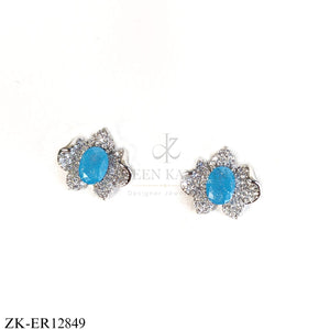 BRIGHT BLUE STONE IN A SILVER FLORAL SHAPE EARRINGS