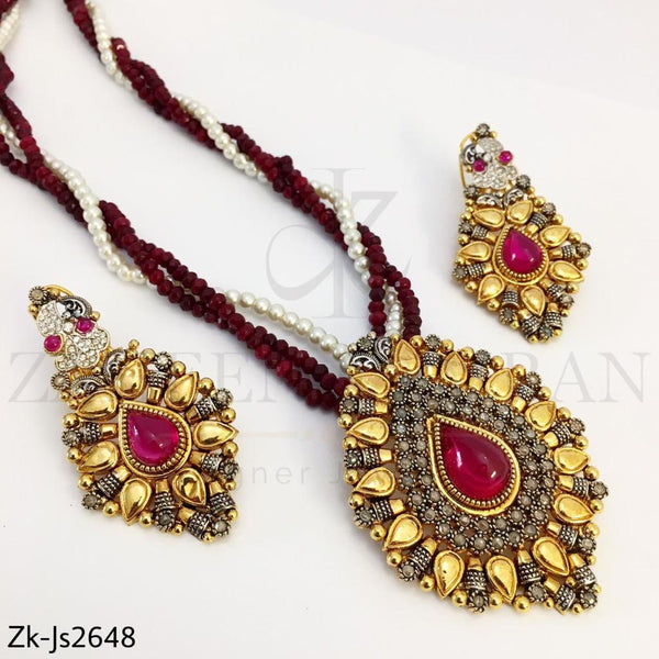 Golden ruby pendant mala