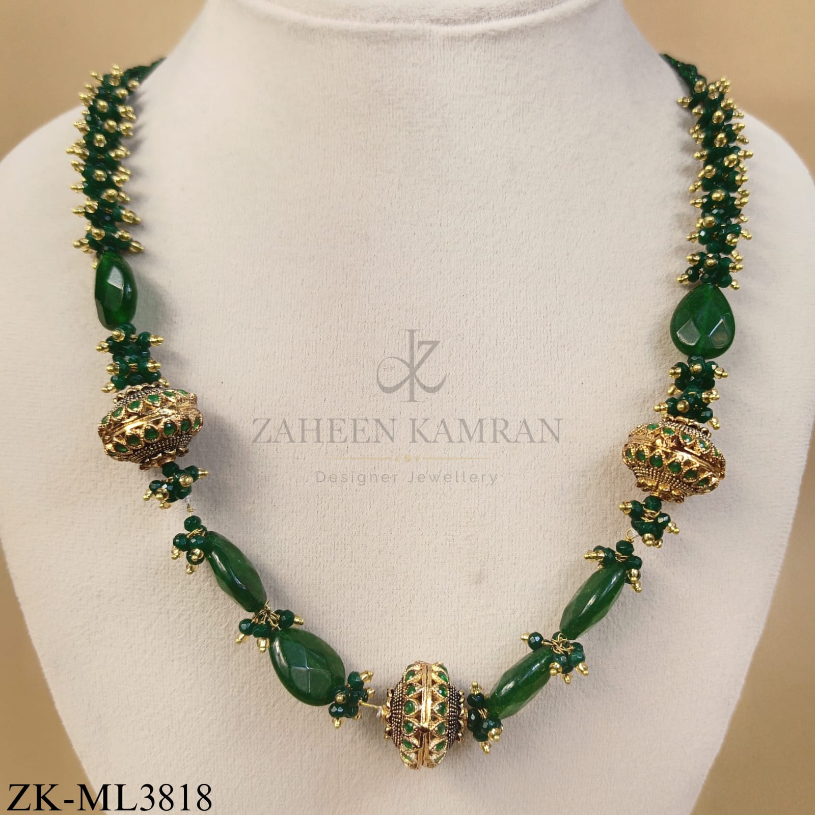 GOLD CARVED BALLS WITH EMERALD CLUSTERS