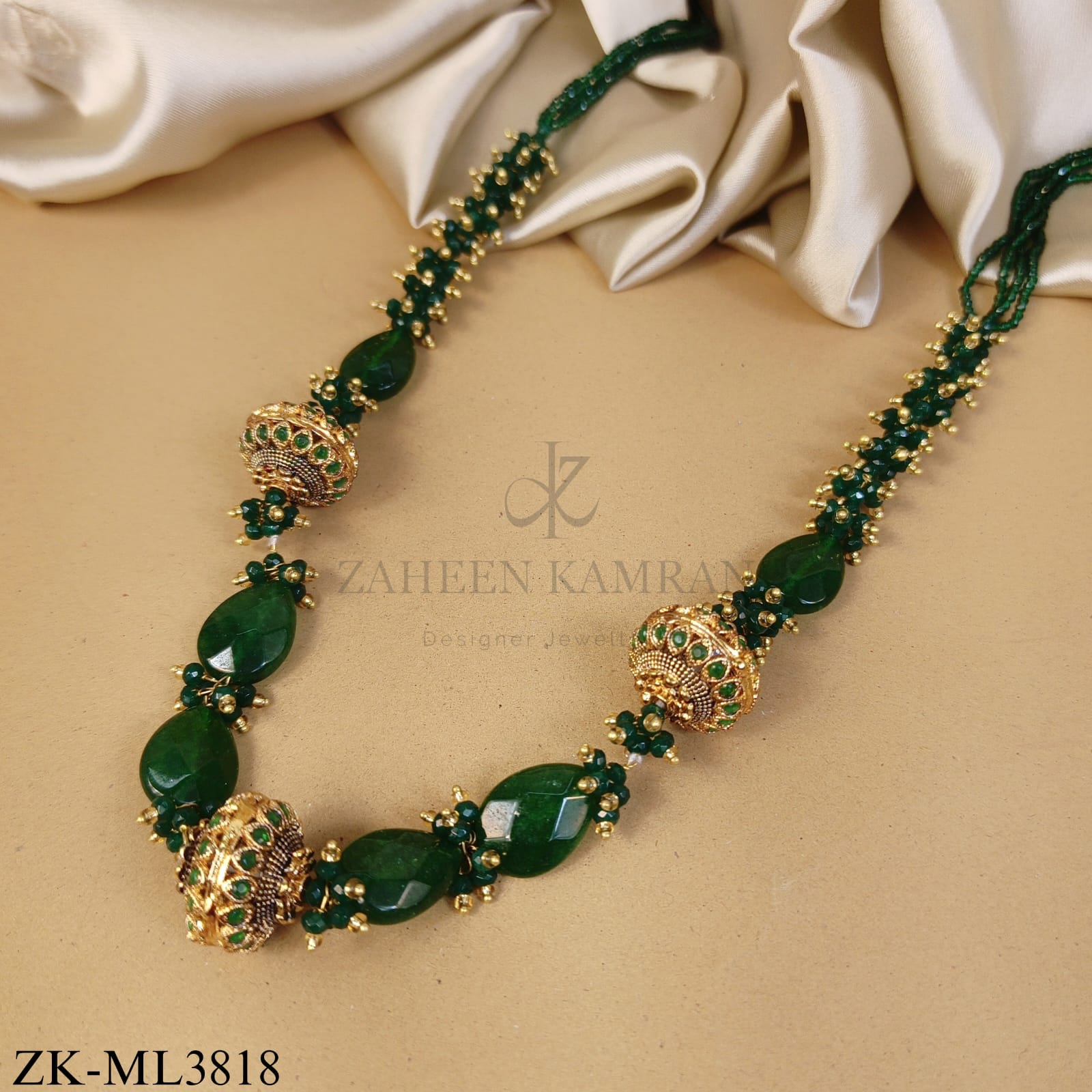 GOLD CARVED BALLS WITH EMERALD CLUSTERS