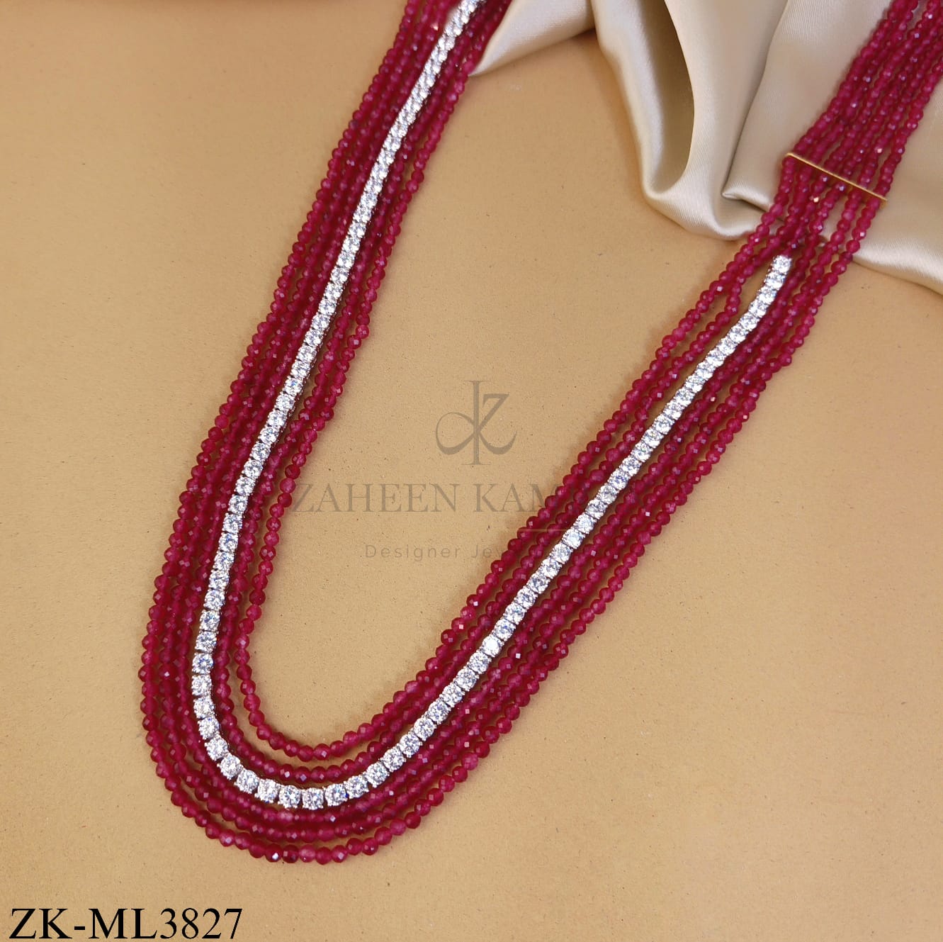 MULTI LAYERED RUBY MALA WITH ZIRCONIAN CENTRE