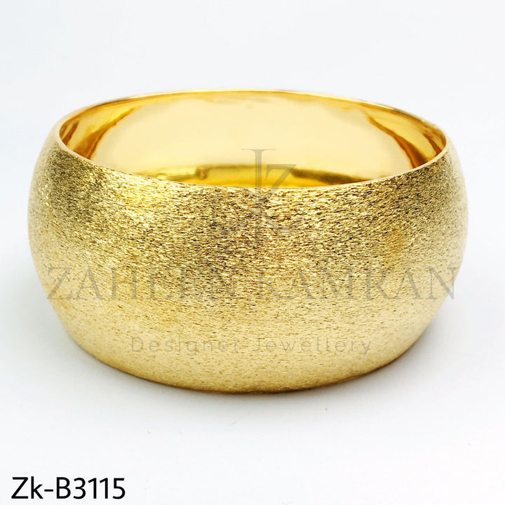 Simple golden bangle.