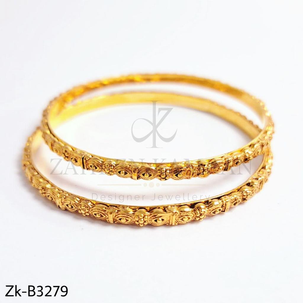 Sleek golden bangles.