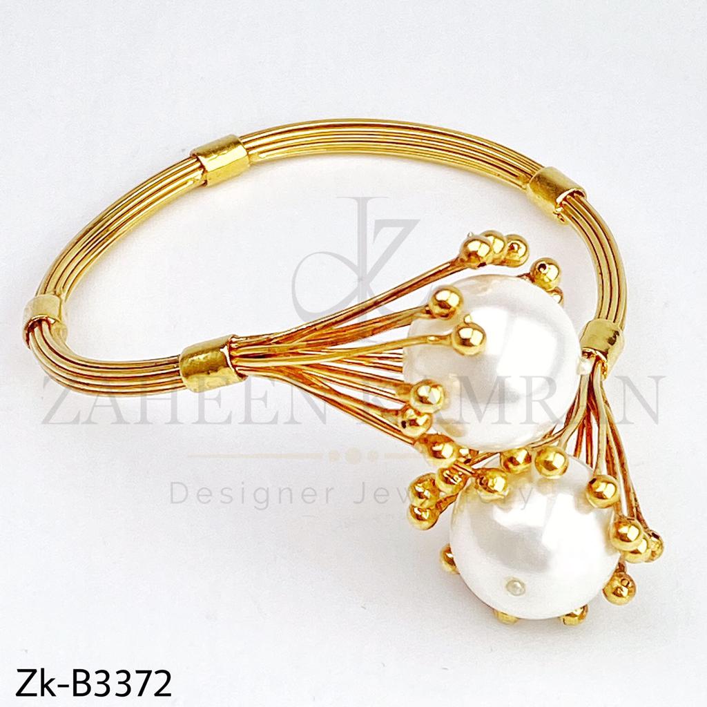 Big pearl bangle.