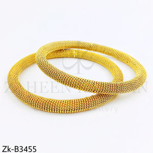 Golden bangles.