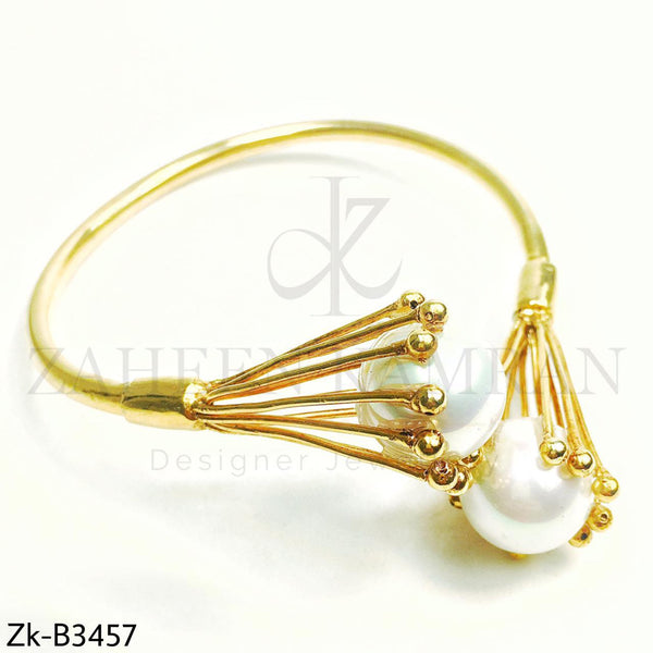 Big pearl bangle.