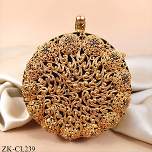 CIRCULAR EMERALD CLUTCH