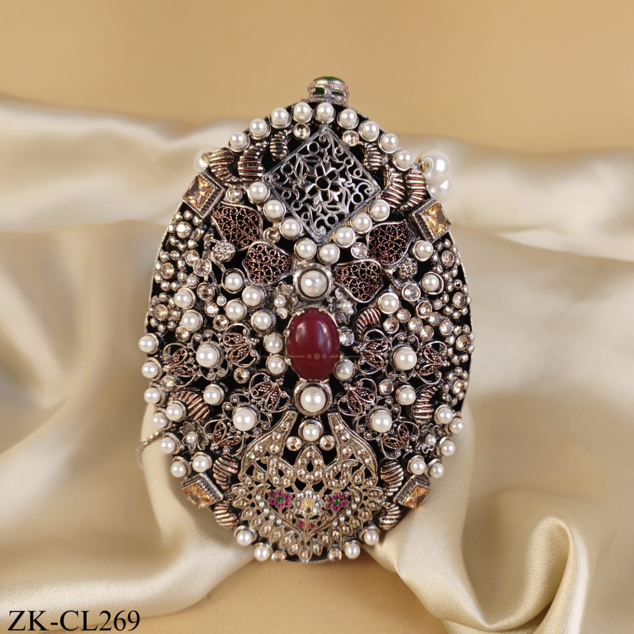 SILVER AMBER CLUTCH WITH DEEP RED CENTRE STONE