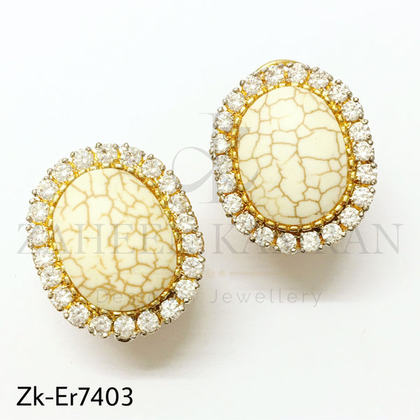 White oval studs