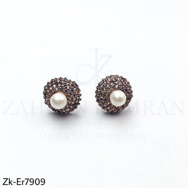 Big pearl studs.