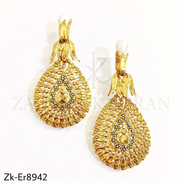 Drop golden earrings.