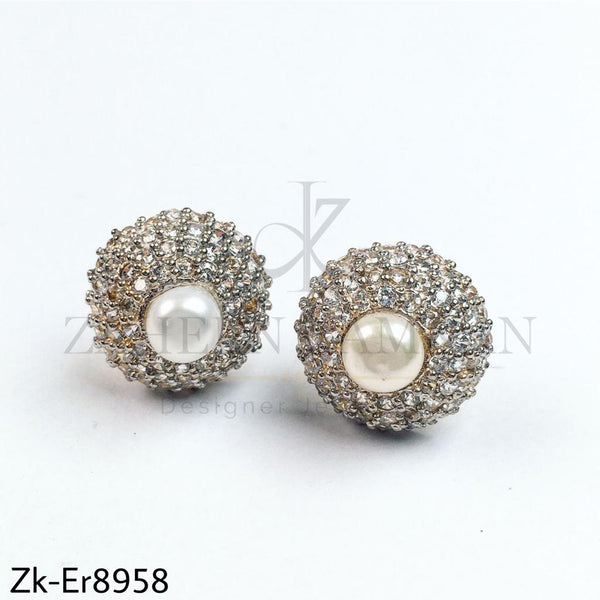 Big pearl studs.