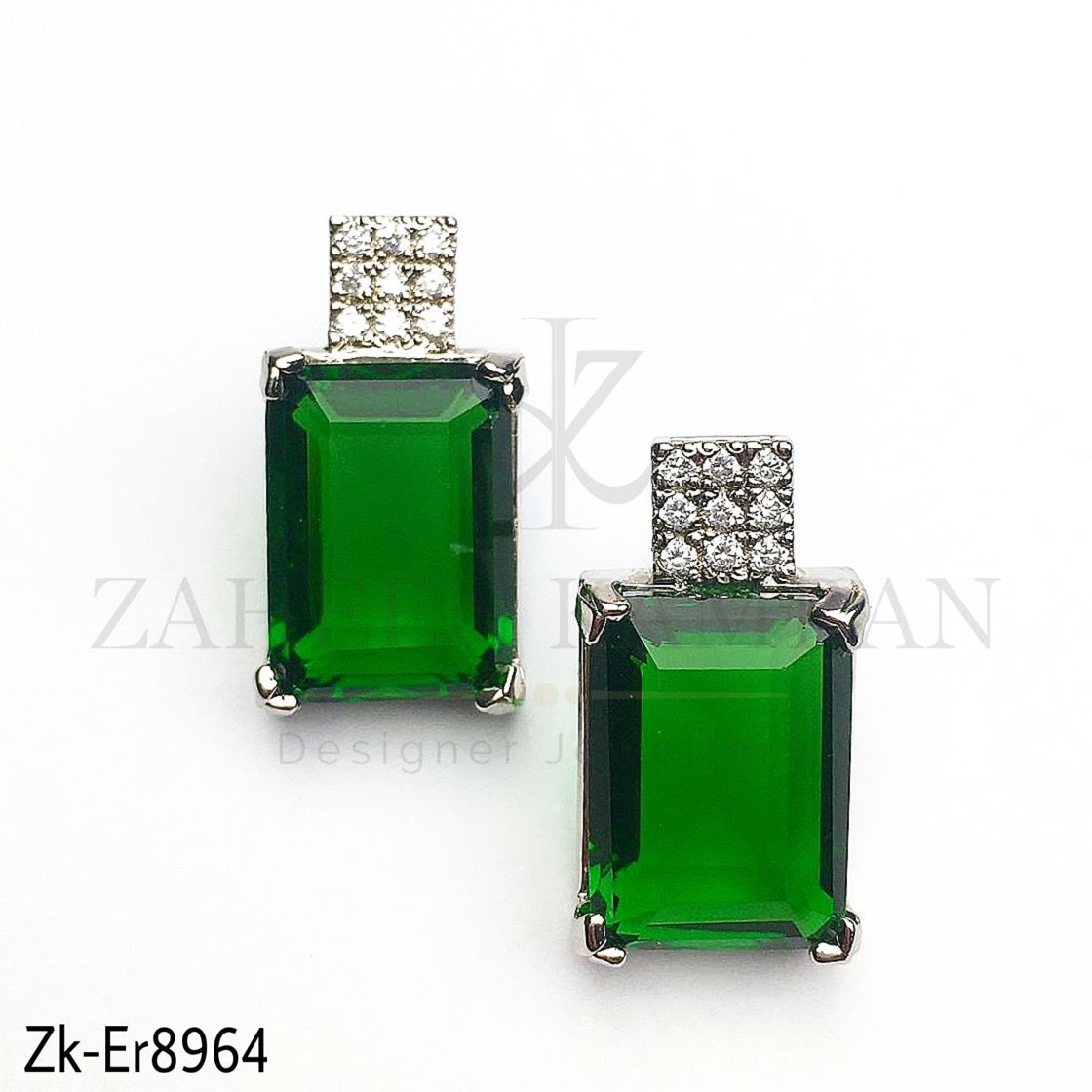 Squarish silver earrings.