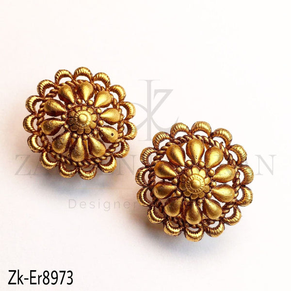 Golden floral studs.