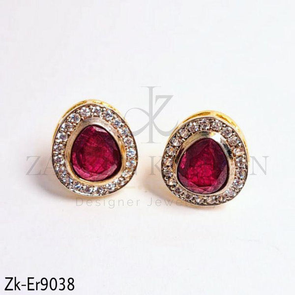 Garnet styli studs.