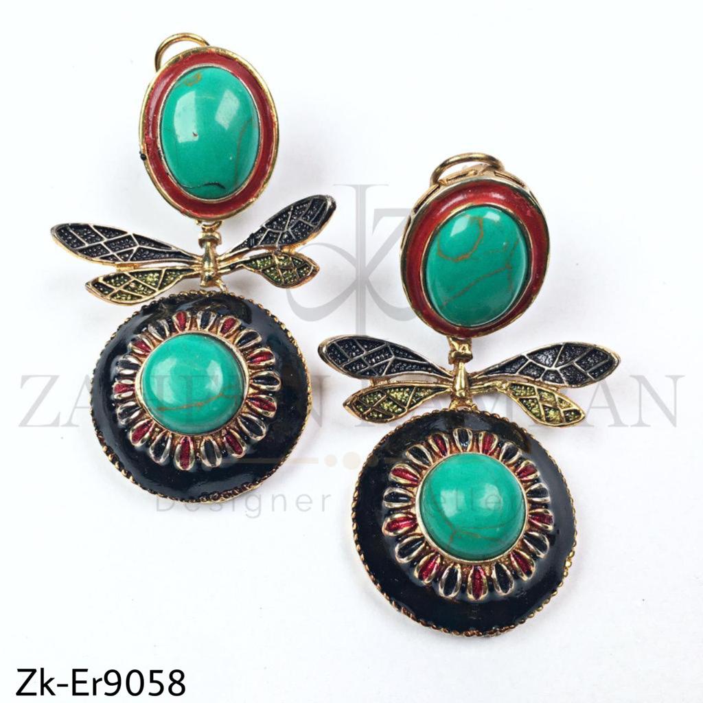 Wing style earrings.