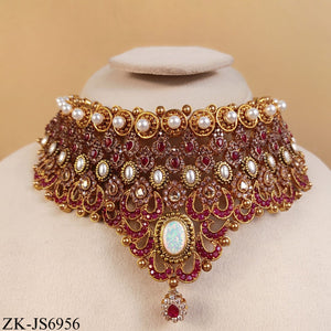 GOLD TONE RUBY SET WITH OPAL CENTREPIECE