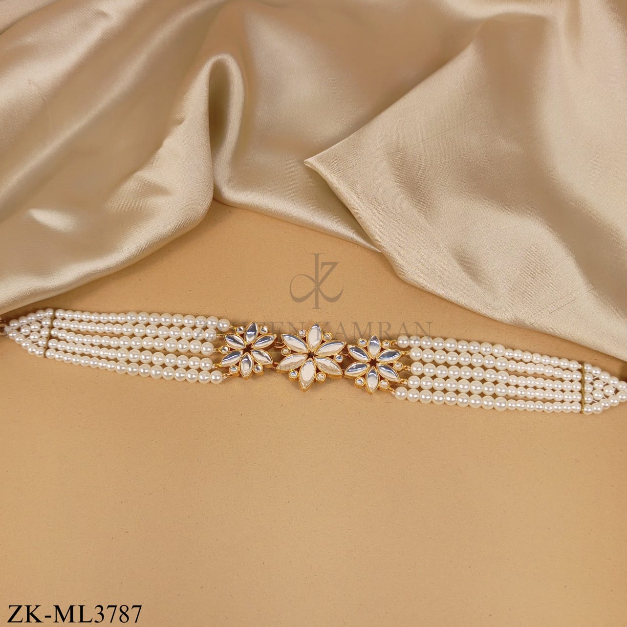 FOUR STRAND PEARLS MALA WITH A FLORAL MOTIFS