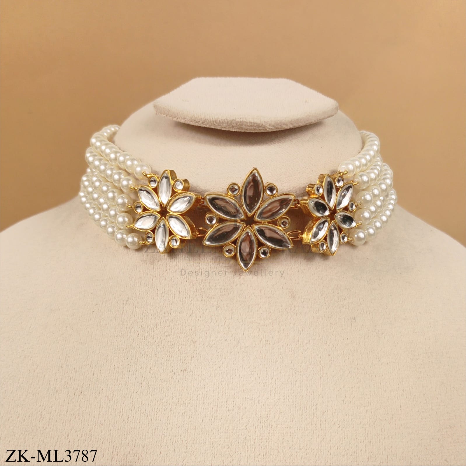 FOUR STRAND PEARLS MALA WITH A FLORAL MOTIFS