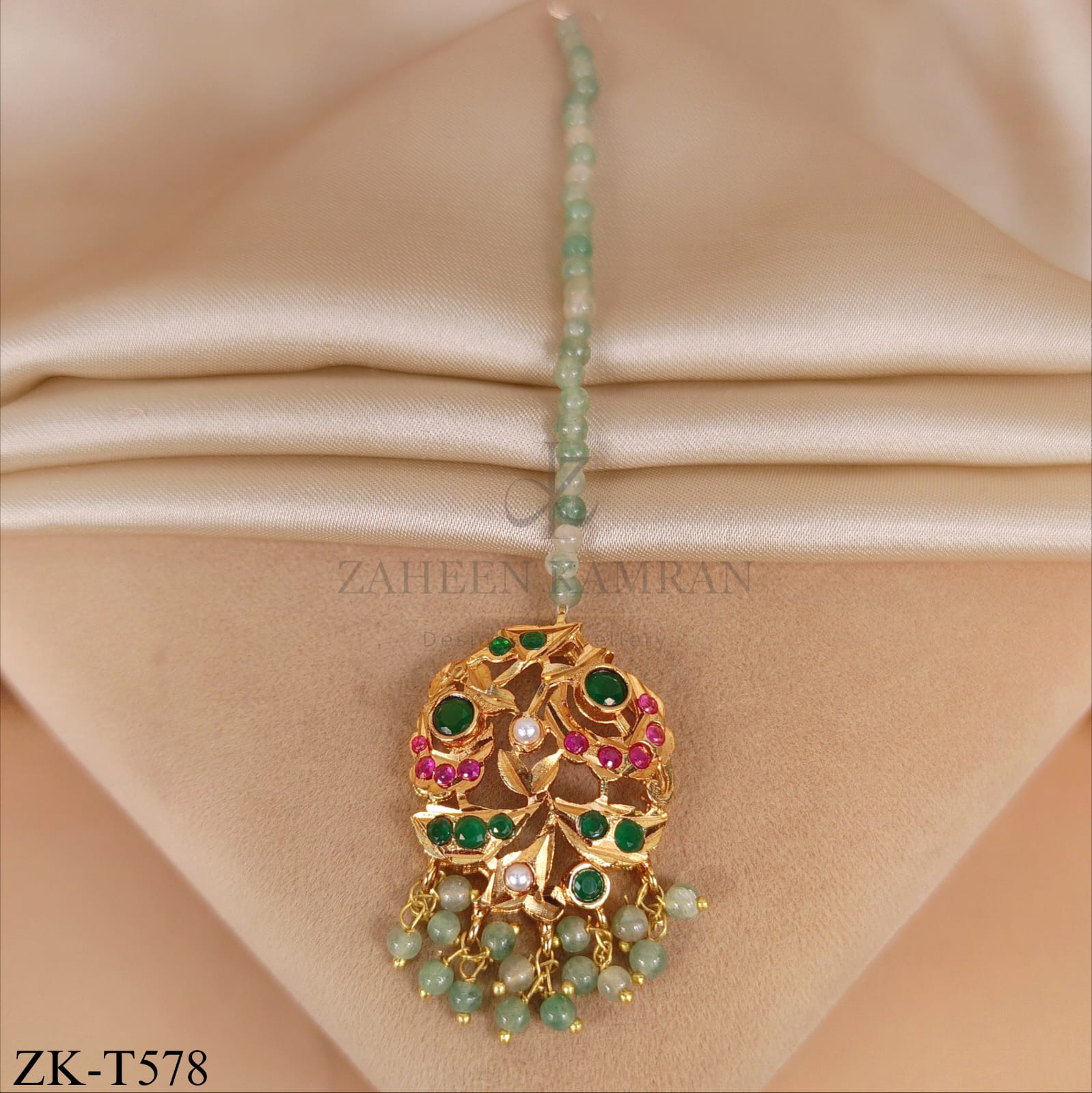 GOLD TIKKA WITH RUBY AND EMERALD GEMS
