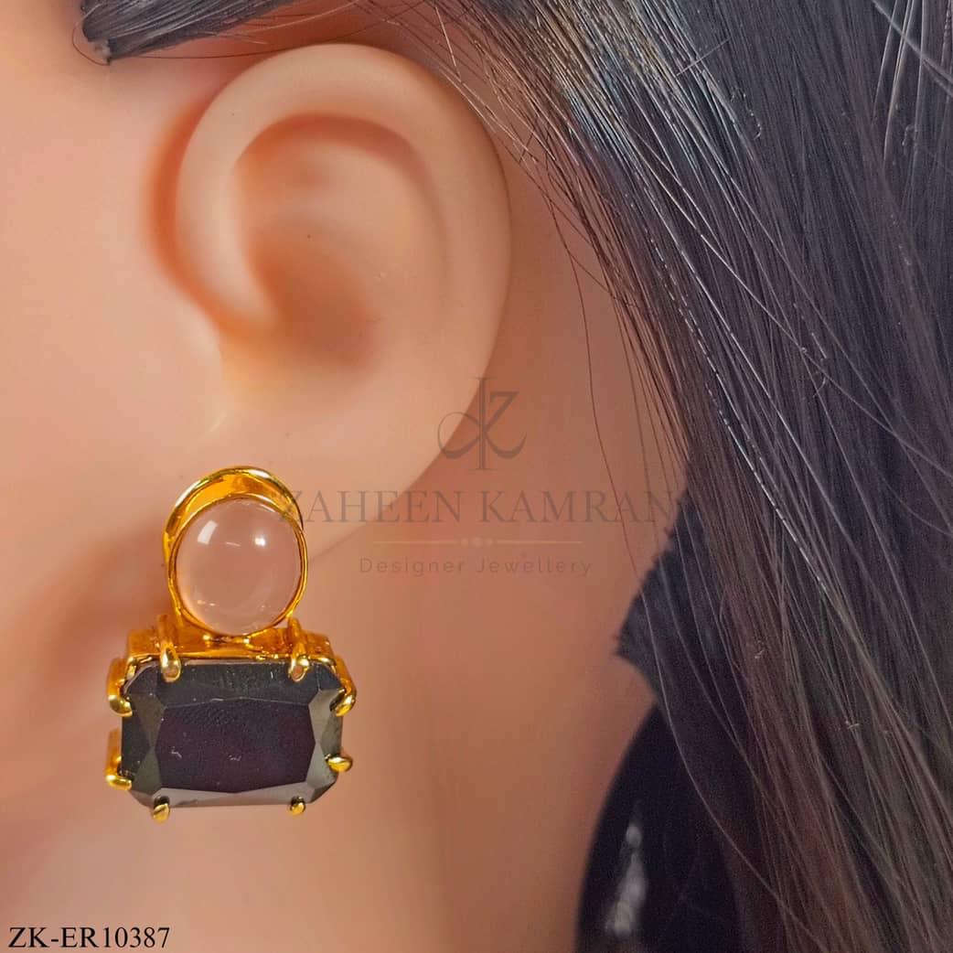 Earrings studded with sapphire and pink stones